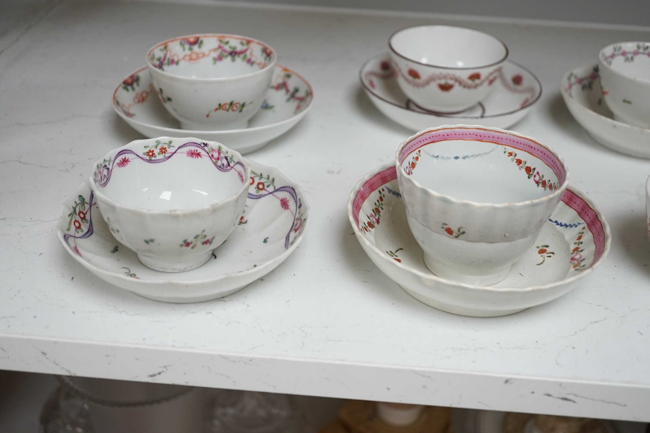 A quantity of Newhall teabowls and saucers and a pearlware tea bowl and saucer, c.1790-1800